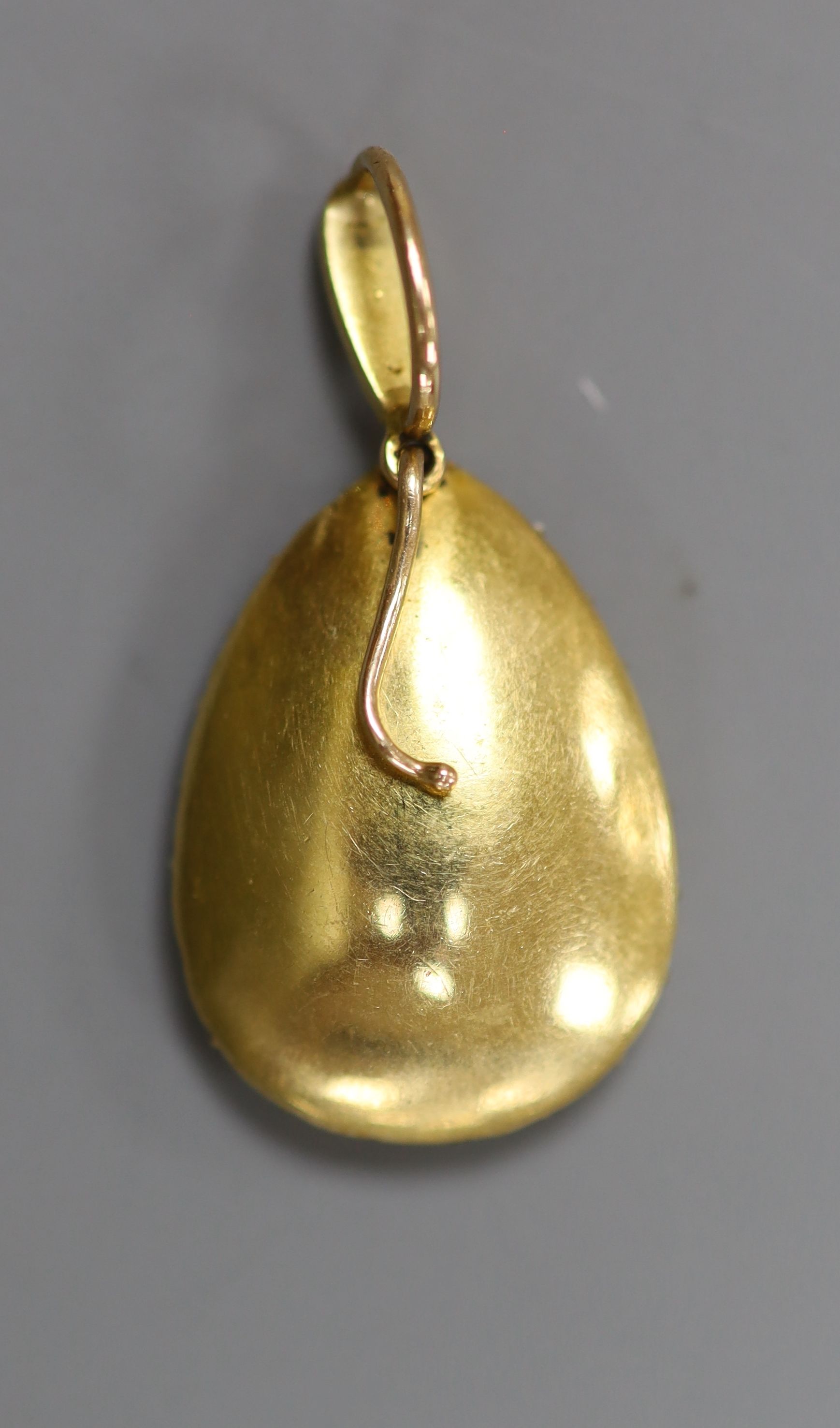 An Edwardian yellow metal, citrine and seed pearl set pear shaped pendant